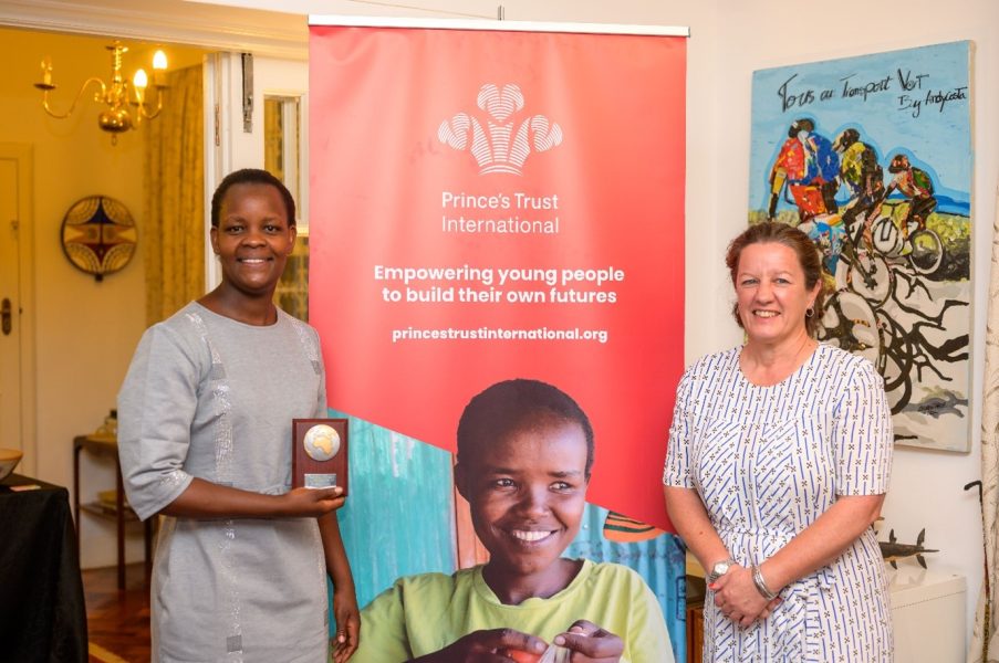 Rinah with her award on the left and the British Deputy High Commissioner Josephine Gauld on the right