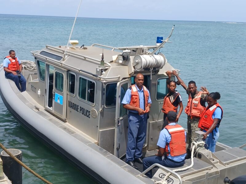 Young people from Team in Saint Lucia on a boat of the Marine Police