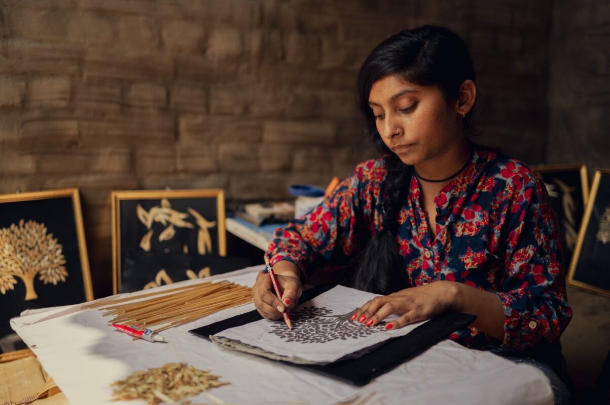 Rachna drawing on her desk