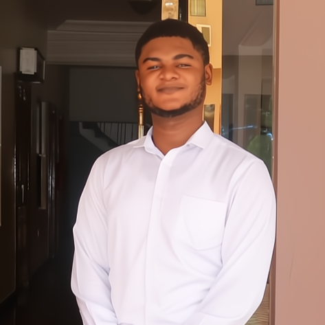 Isaac from Ghana in front of the hotel he now works at