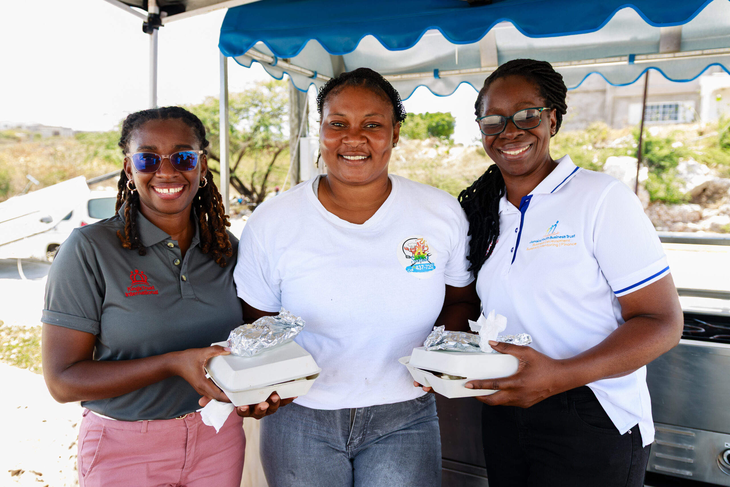 Karona with KTI and JYBT staff at her grill