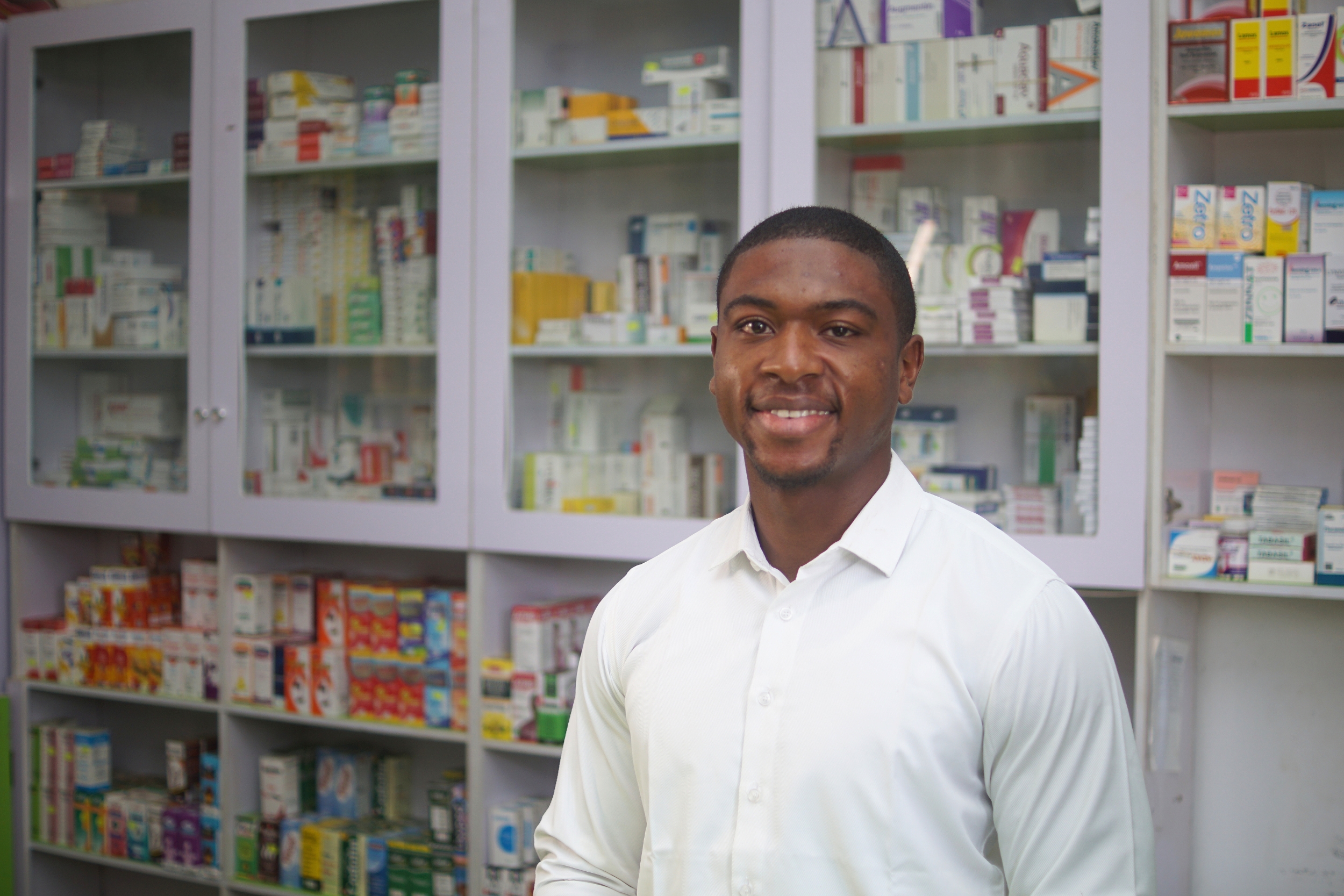 Oluchukwu from our Sustainable Enterprise Challenge programme in Nigeria inside his pharmacy